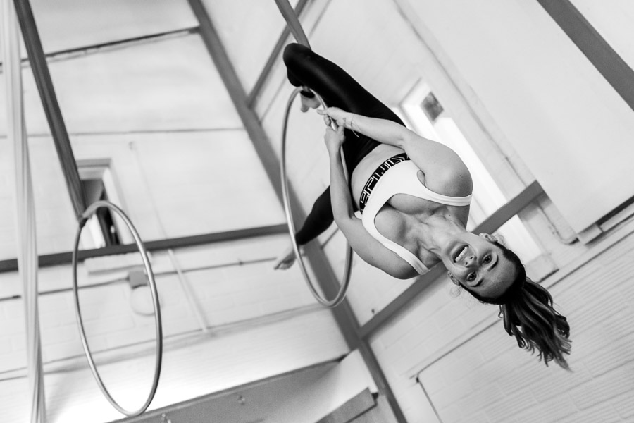 A Colombian aerial dancer hangs upside-down on aerial hoop during a training session in a gym in Medellín, Colombia.