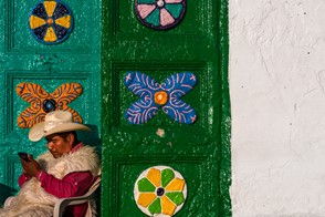 A Maya cowboy texting (San Juan Chamula, Chiapas, Mexico)