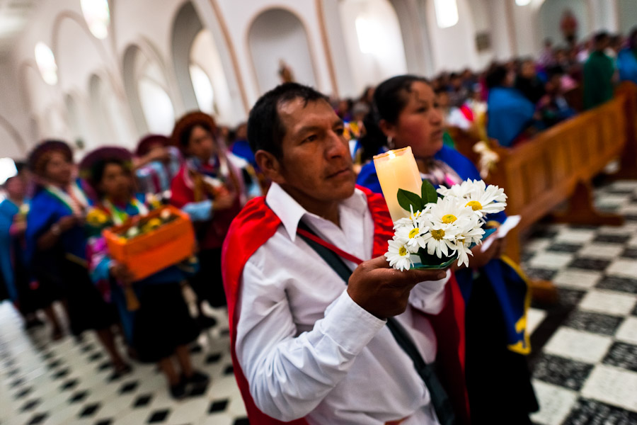 Natives from the Kamentsá tribe participate in the Catholic mass during the Carnival of Forgiveness, a traditional indigenous celebration in Sibundoy, Colombia.