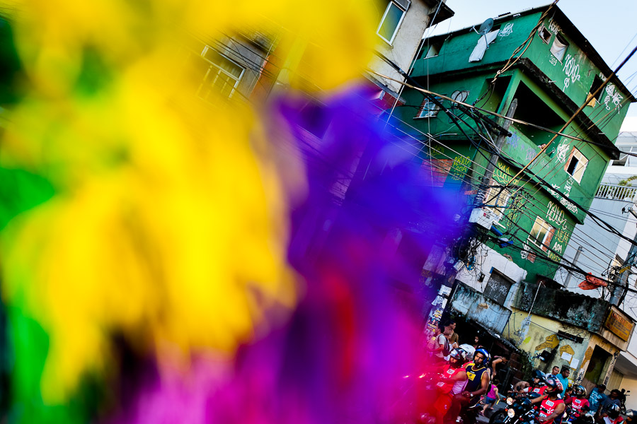 Colorful feather costumes seen on the street during the Carnival parade in the favela of Rocinha, Rio de Janeiro, Brazil.