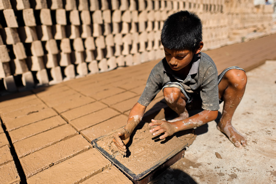 Brian, a ten-year-old Salvadoran boy, works at a brick factory in Istahua, El Salvador.