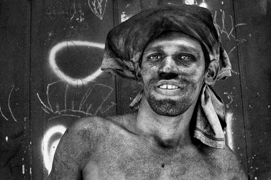 A Brazilian coalman, covered by the black coal dust, deliveres coal in the Santa Teresa neighbourhood, Rio de Janeiro, Brazil.