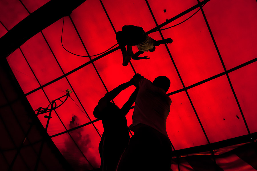 A student performs an acrobatic jump (double salto backward) during the lessons in the circus school Circo para Todos in Cali, Colombia.