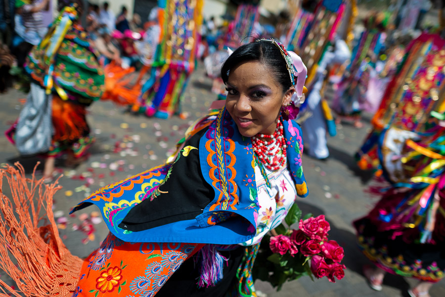 A dancer (danzante) takes part in the religious parade within the Corpus Christi festival in Pujilí, Ecuador.