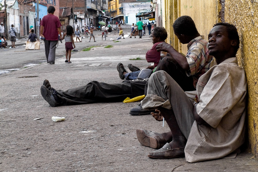 Drug addicts lying on the street of El Calvario. Their motion ability has already been reduced, some of them keep in unstoppable tremor due to the brain damage caused by sniffing glue.