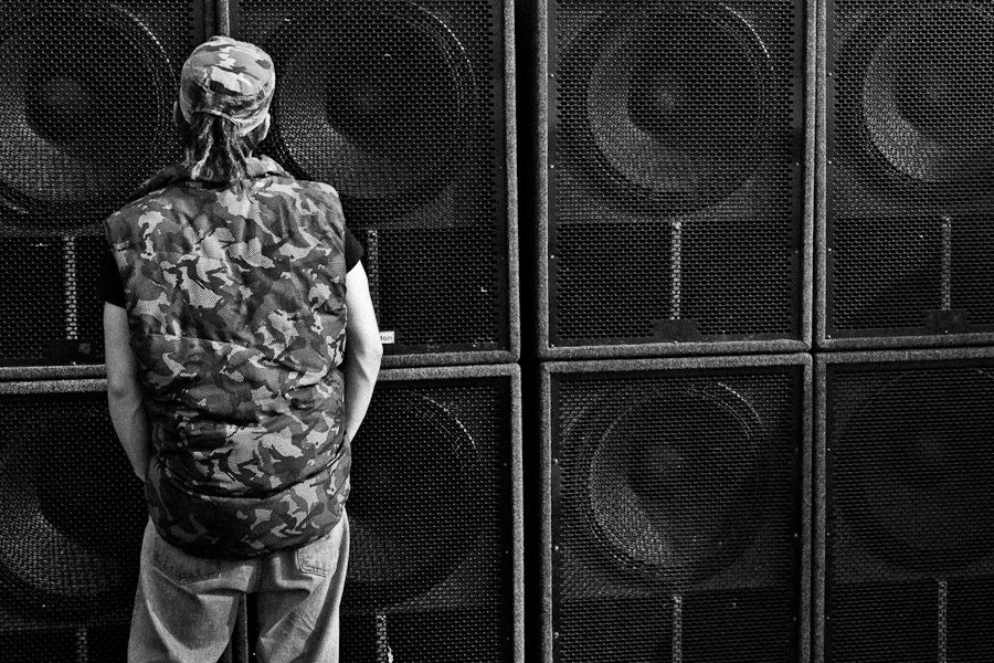 A young man dances in front of the speakers of a Sound System at Czech Free Tekno Festival “Czarotek” close to Kvetná, Czech Republic.