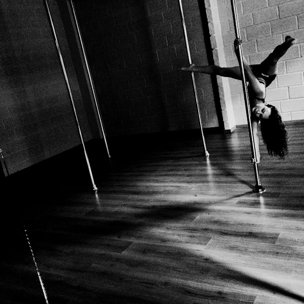 Carolina Echavarria, a young Colombian pole dancer, performs during a pole dance training session at Academia Pin Up, a dance studio in Medellín, Colombia.