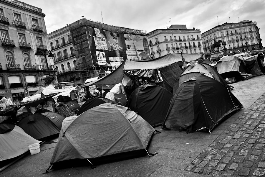 Spanish protesters (Los Indignados) camp in the tent city on Puerta del Sol square, Madrid, Spain.