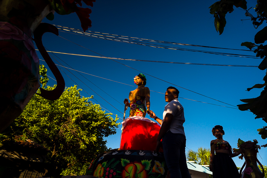 A Mexican “muxe” (typically, a homosexual man wearing female clothes) performs on a float in the traditional procession during the Vela de las Intrépidas festival in Juchitán de Zaragoza, Oaxaca, Mexico.