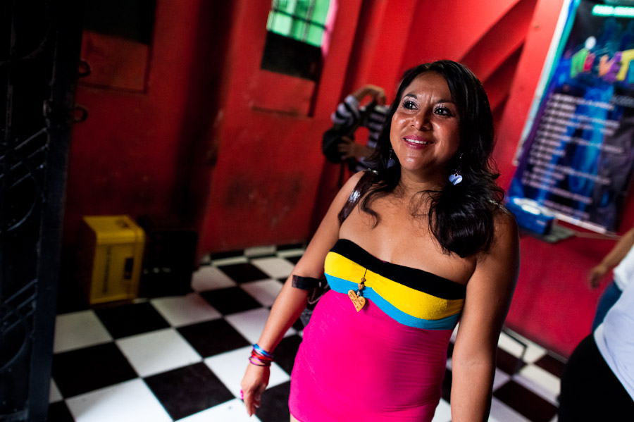 A prostitute leaves a discotheque in San Salvador, El Salvador.