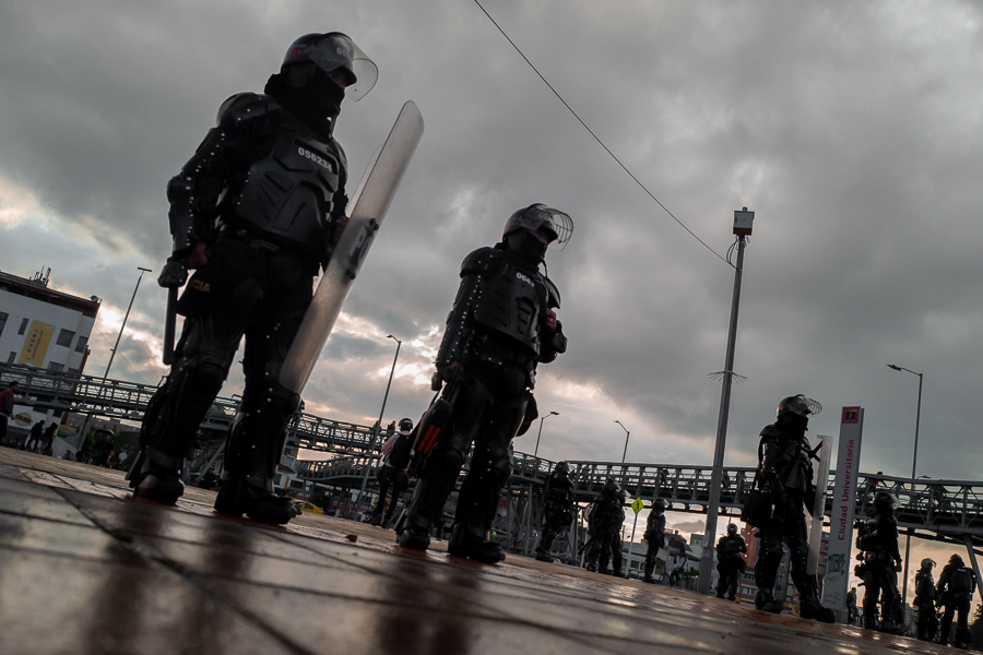 Colombian riot control policemen guard in front of the Universidad Nacional de Colombia during a protest march against government’s policies and corruption within the public educational system in Bogotá, Colombia.