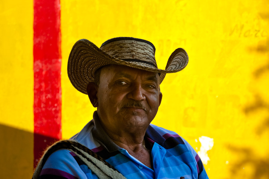 A Colombian man wears the traditional vueltiao hat in the mountains of Sierra Nevada, Colombia.