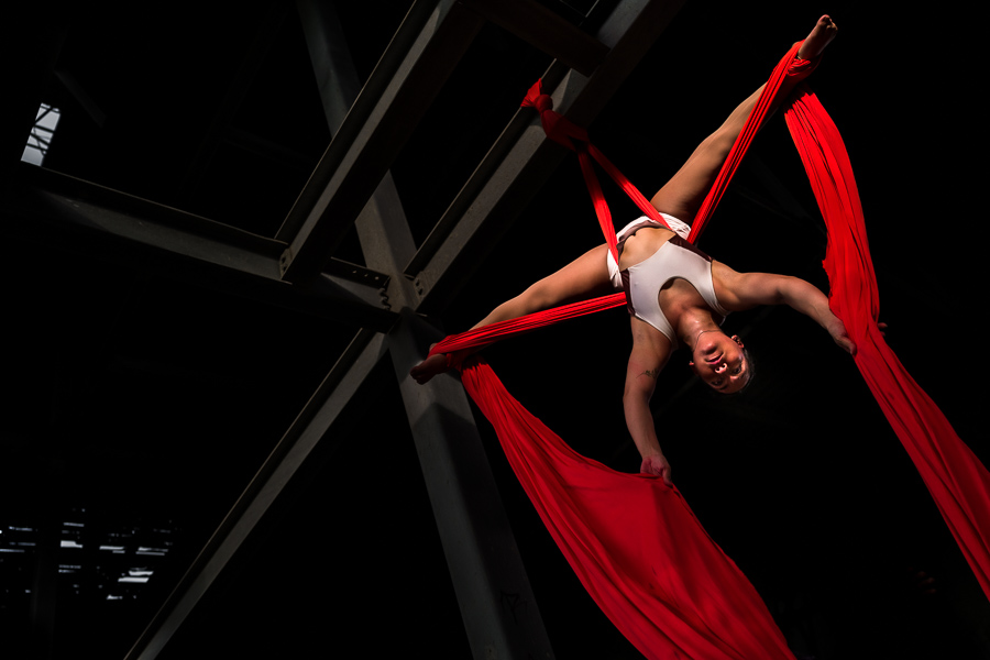 Shara Guzman, a Venezuelan aerial dancer, performs on aerial silks during an art performance in an industrial space in Barranquilla, Colombia.