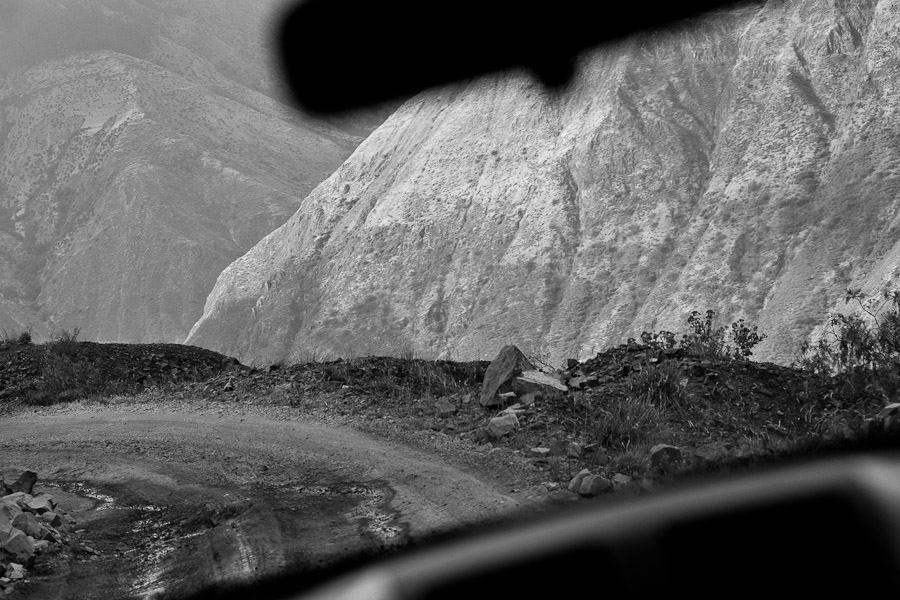 A sharp curve without any safety fence seen from a car going down the ‘24 curvas’, a narrow unpaved road in Apurímac river canyon, Peru.