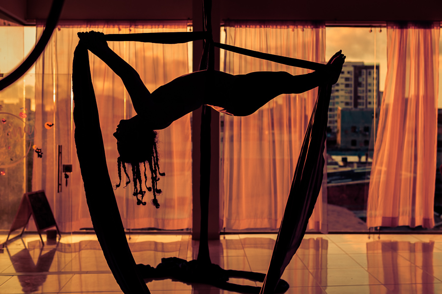 A Colombian aerial dancer performs on aerial silks during a training session in the Oshana gym in Barranquilla, Colombia.