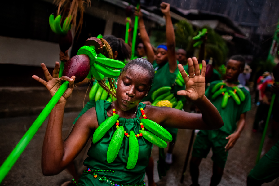 Afro-Colombian dancers of the Pandeyuca neighborhood perform in the rain during the San Pacho festival in Quibdó, Colombia.
