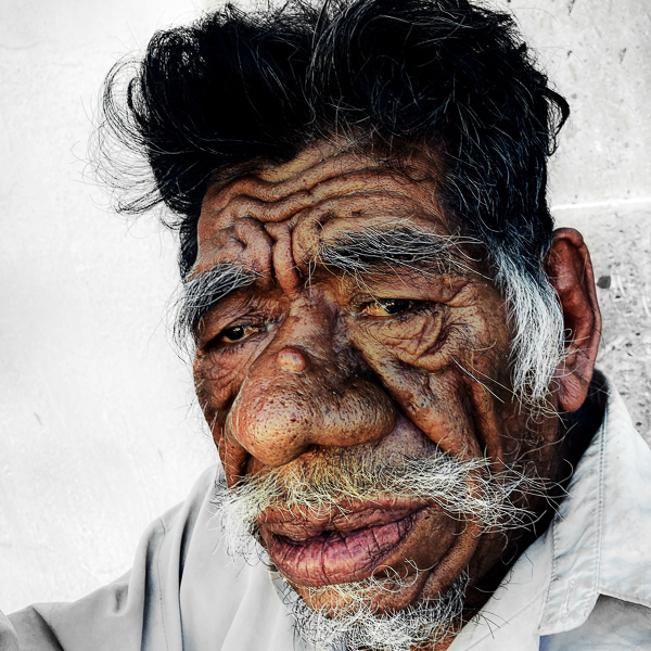 An old Afro-Mexican man poses for a picture in the street of Ometepec, Guerrero, Mexico.