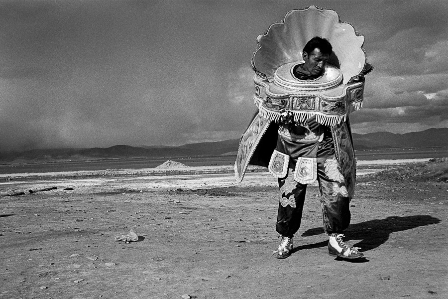 A Bolivian peasant dances on a vast mountain plateau during the festival of Our Lady of Mount Carmel, Oruro, Bolivia.