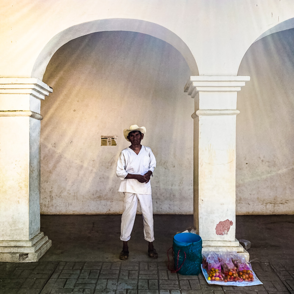 A “Ñancue Ñomndaa” (Amuzgo) indigenous man sells his homegrown tomatoes on the main square in Xochistlahuaca, Guerrero, Mexico.