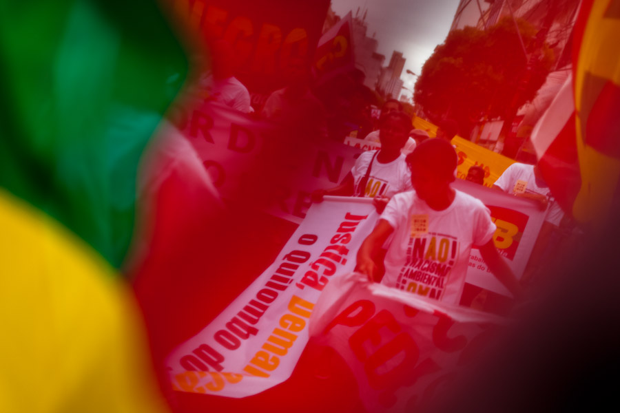 Protesters, holding radical banners, march at the anti-city council manifestation in Salvador, Bahia, Brazil.
