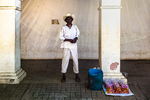 An Amuzgo man sells tomatoes (Xochistlahuaca, Guerrero, Mexico)