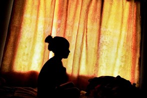 Girl in front of a window (Mindo, Ecuador)