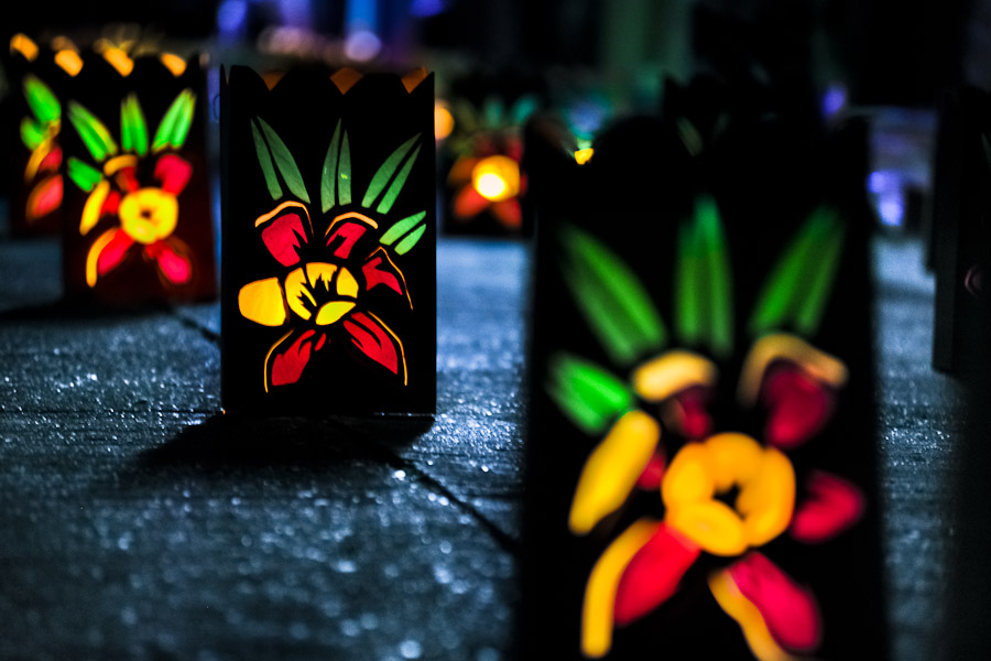 Colorful paper lanterns, depicting flower blossoms, illuminate the street during the annual Festival of Candles and Lanterns in Quimbaya, Colombia.