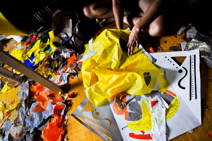 A Colombian girl works on a paper lantern in her house before the annual Festival of Candles and Lanterns in Quimbaya, Colombia.