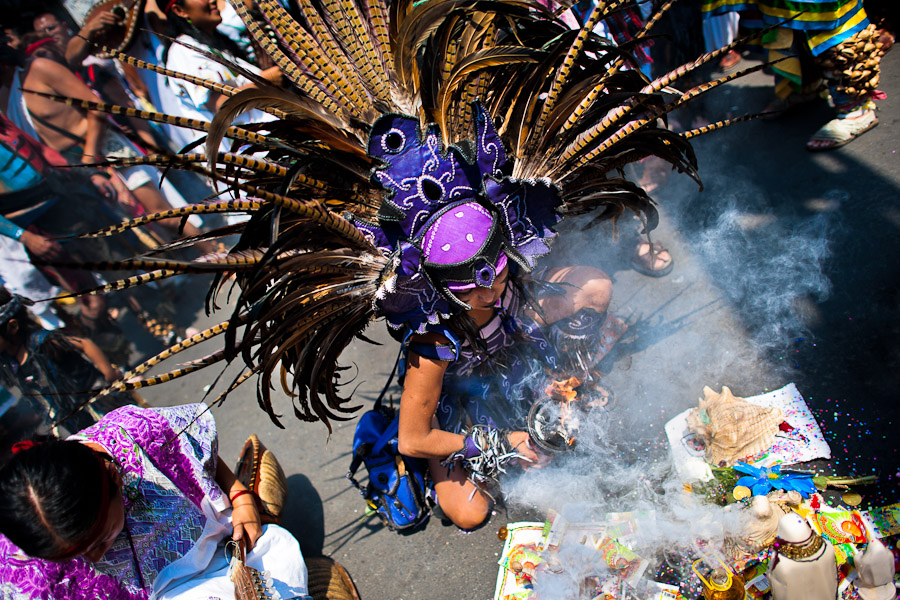 A Mexican indigenous dancer performs an ancient Aztec Death Worship dance during a ceremony honoring Santa Muerte (Saint Death) in Mexico City, Mexico.