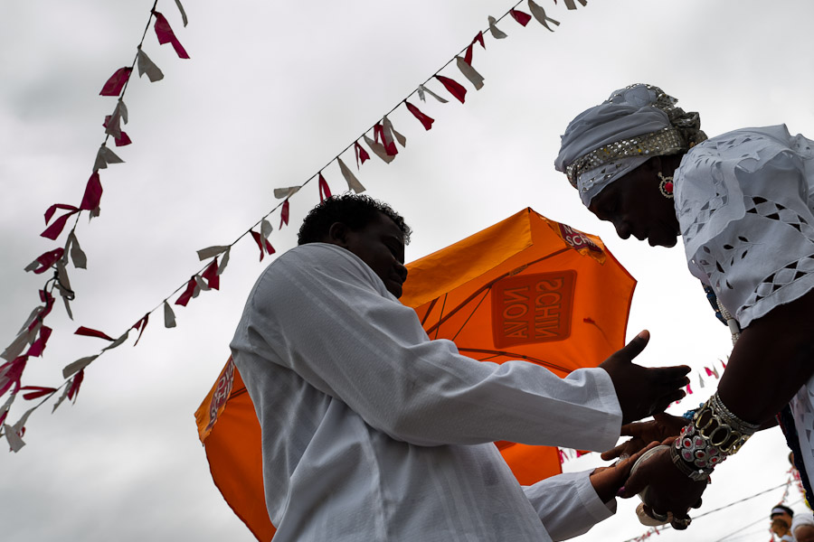 A Baiana woman performs the ‘popcorn bath’, an Afro-Brazilian spiritual cleansing ritual, in front of the St. Lazarus church in Salvador, Bahia, Brazil.