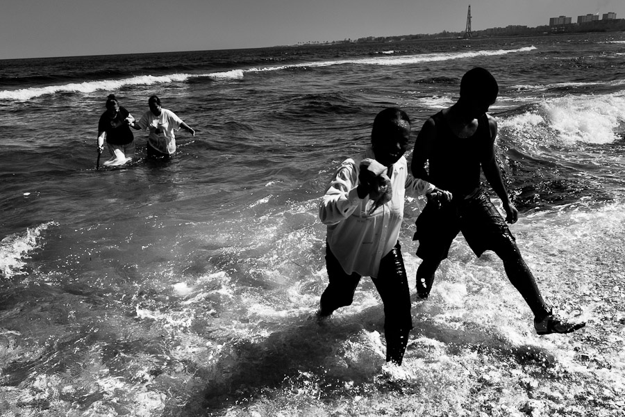 Christian believers take part in a baptism ritual on the beach near the village of Cojímar, east of Havana, Cuba.