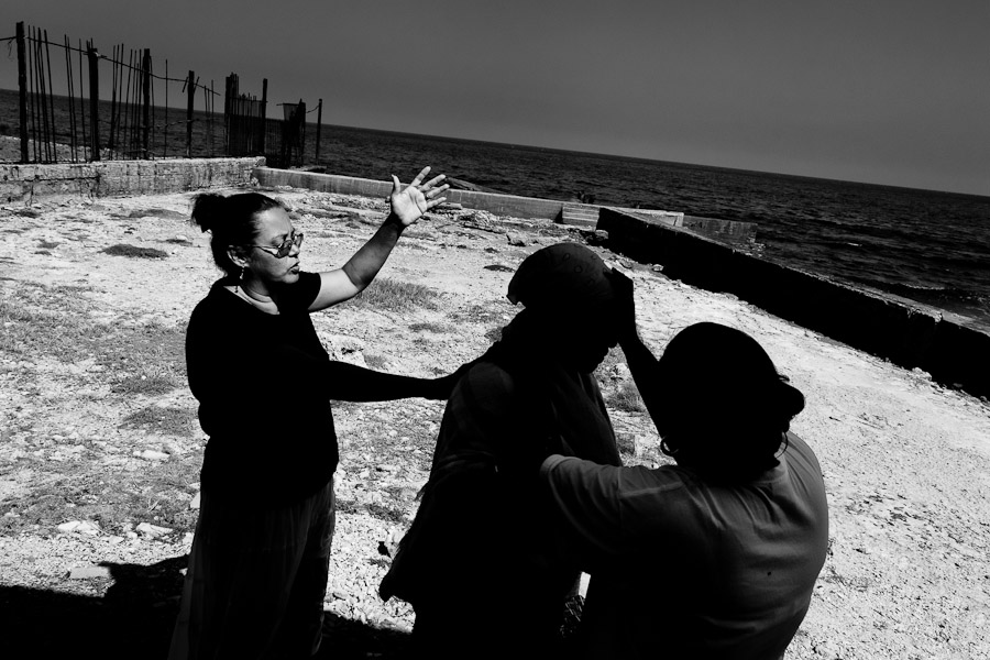 A Christian follower takes part in a baptism ritual on the beach near the village of Cojímar, east of Havana, Cuba.