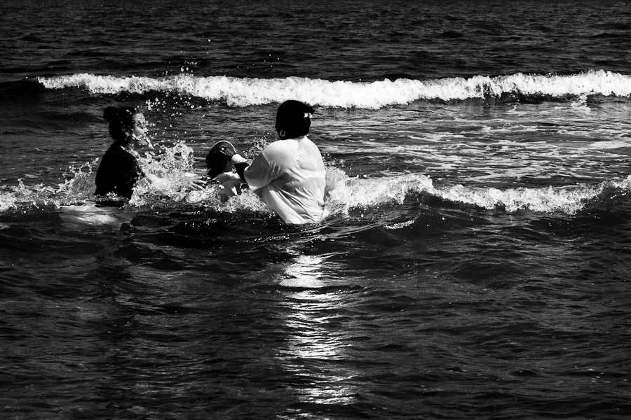 A Christian follower takes part in a baptism ritual in the waters of the Caribbean Sea near the village of Cojímar, east of Havana, Cuba.