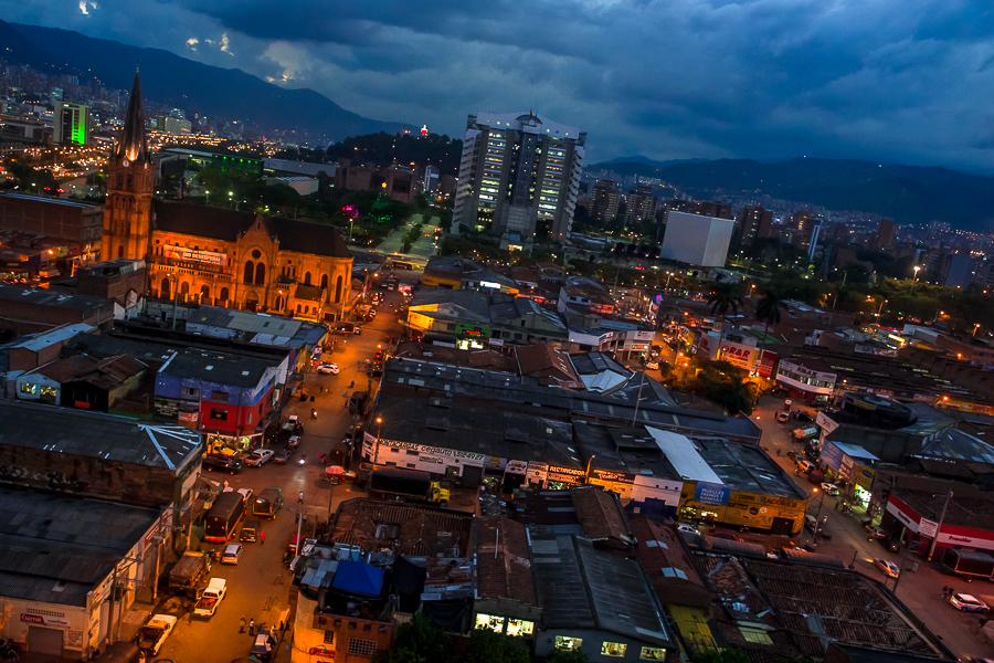 A view of Barrio Triste, a car mechanics neighborhood, is seen from a rooftop during the twilight in Medellín, Colombia.