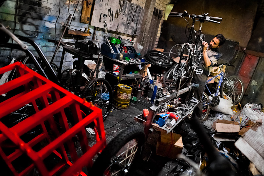 A bicycle mechanic assembles a custom made bike in a small scale bicycle factory in Bogota, Colombia.