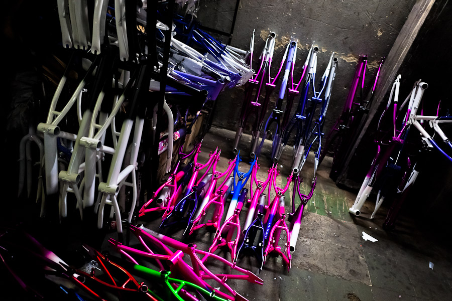 Painted and cured bike framesets are seen on the floor of a small scale bicycle factory in Bogota, Colombia.