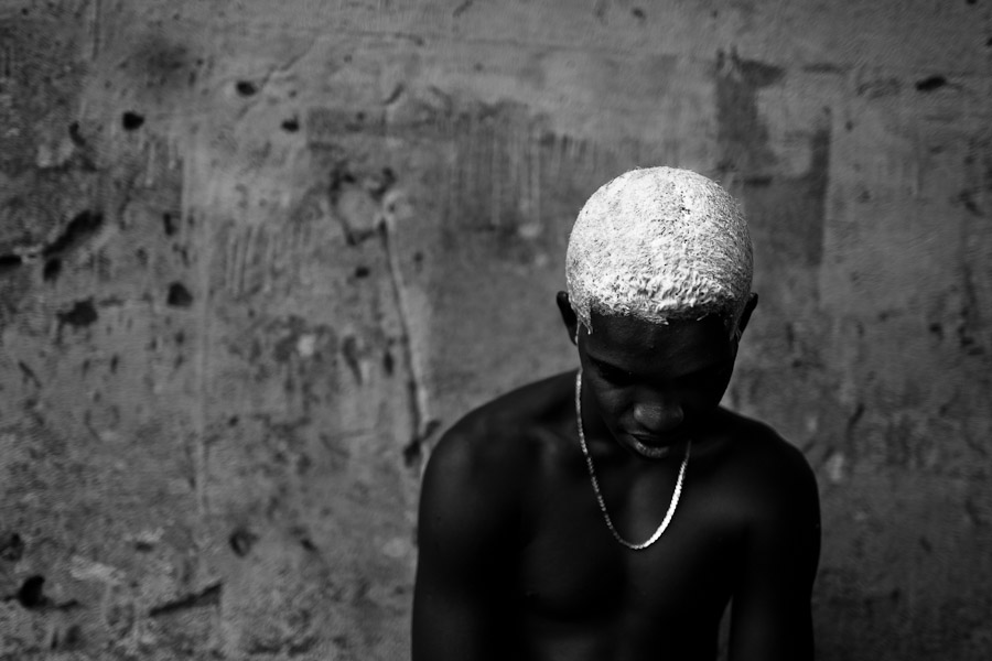 Brazilian boy bleaches his hair with peroxide before the Carnival in Rio de Janeiro, Brazil.