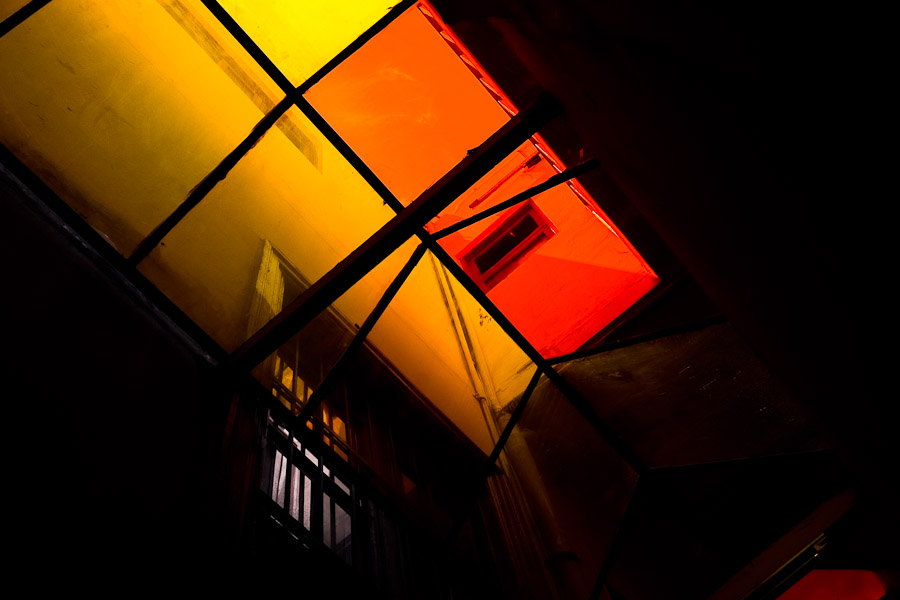 A corridor illuminated through the roof window in Unión Nacional de Ciegos del Perú, a social club for the visually impaired in Lima, Peru.