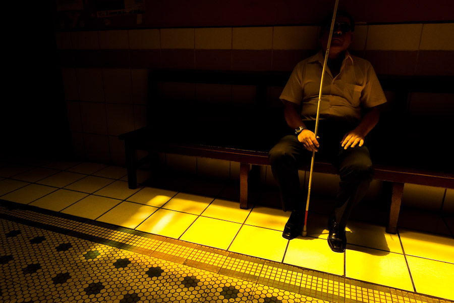 A blind man relaxes in the foyer of Unión Nacional de Ciegos del Perú, a social club for the visually impaired in Lima, Peru.