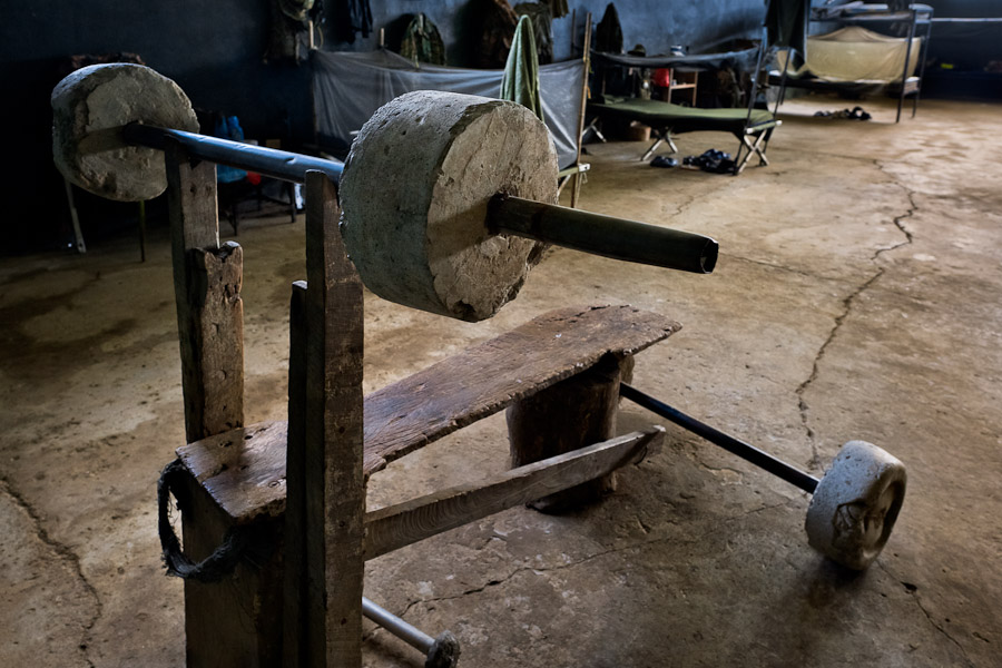 A homemade barbell bench is seen in the soldiers' dormitory of a military base in the jungle of Darien gap, Panama.