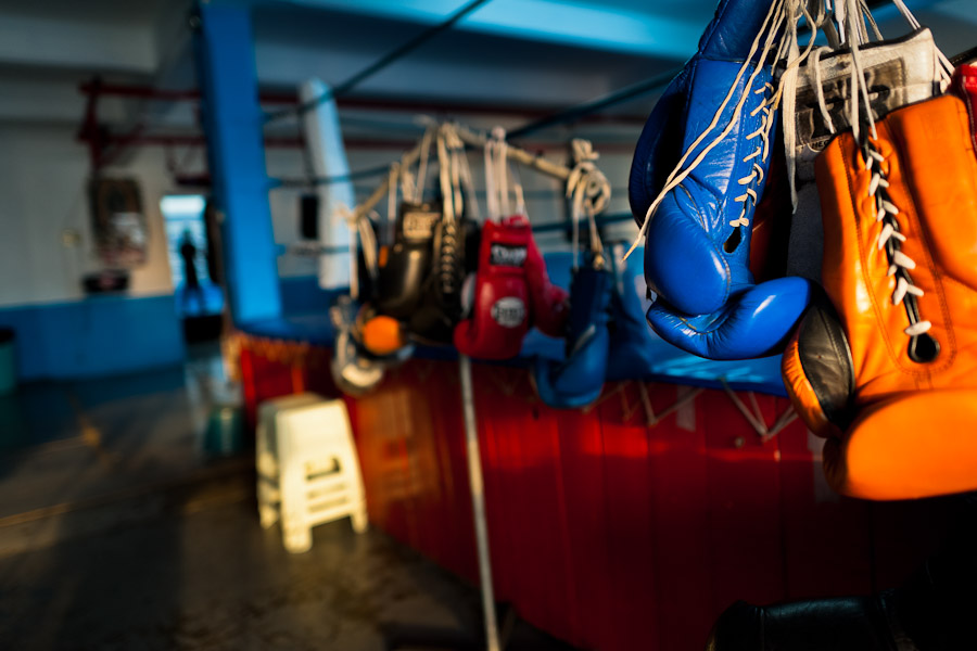 Boxing gloves hung off a rack in the boxing gym in Mexico City, Mexico.