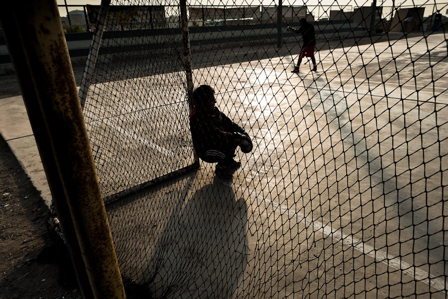 A Peruvian youth takes a break after sparring session at the Boxeo VMT boxing club in an outdoor gym in Lima.