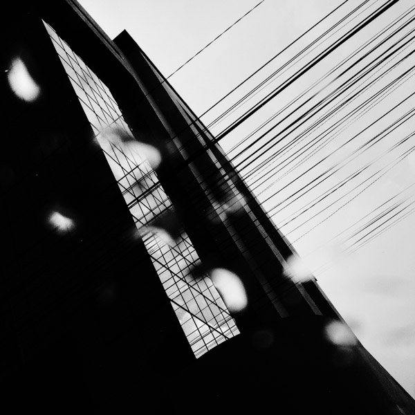 A tower building seen through the taxi window during a heavy rain in Quito, Ecuador.