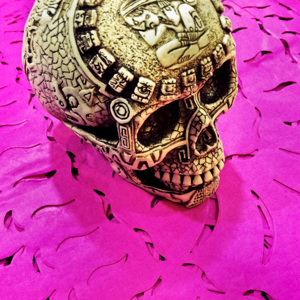 A decorated skull (Calavera) is placed on chiseled paper flags (Papel picado) before the start of the Day of the Dead (Día de Muertos) festivities in Mexico City, Mexico.