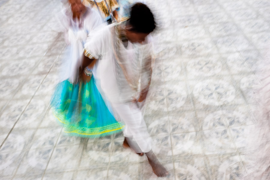A Candomblé follower dances during an Afro-Brazilian religious ritual in the temple (terreiro) on Itaparica island, Bahia, Brazil.