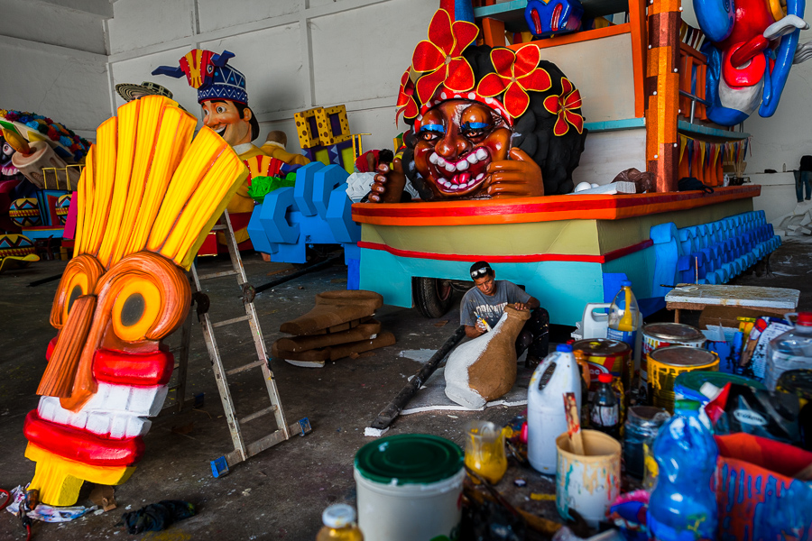 A Colombian artisan paints a paper-mâché element for an allegorical float at the Carnival float workshop in Barranquilla, Colombia.