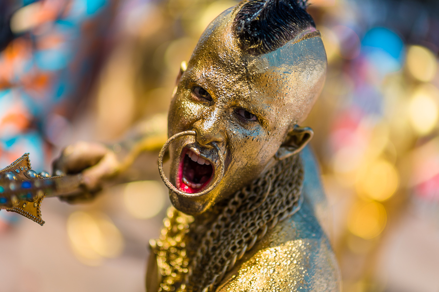 A Colombian man, painted in gold and representing the original indigenous people, performs during the Carnival parade in Barranquilla, Colombia.
