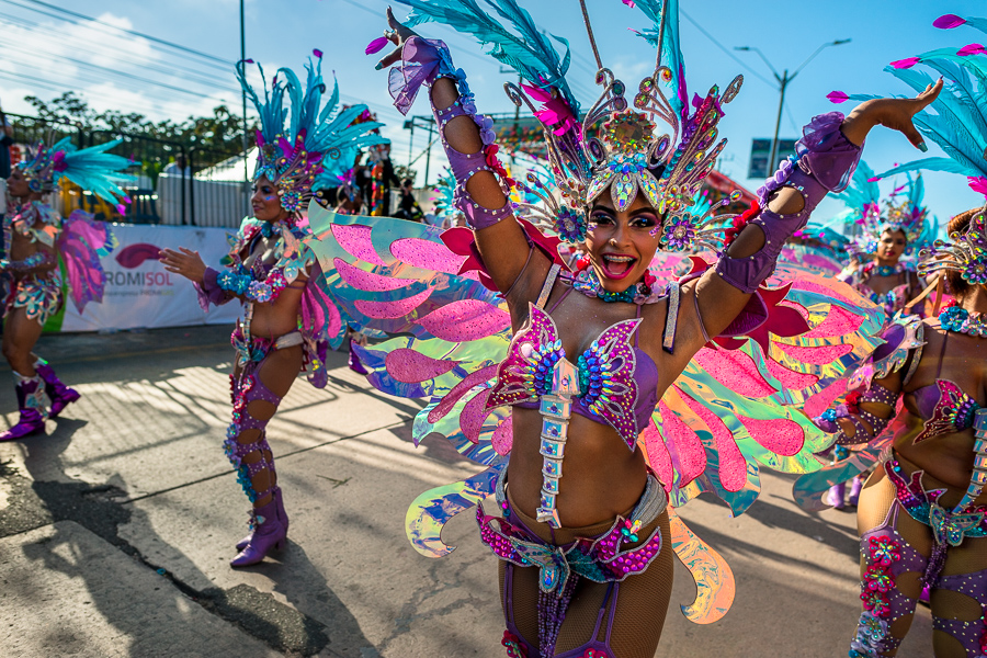 Afro-Colombian women, wearing sensual costumes, dance salsa during the Batalla de Flores, the major parade of the Carnival in Barranquilla, Colombia.