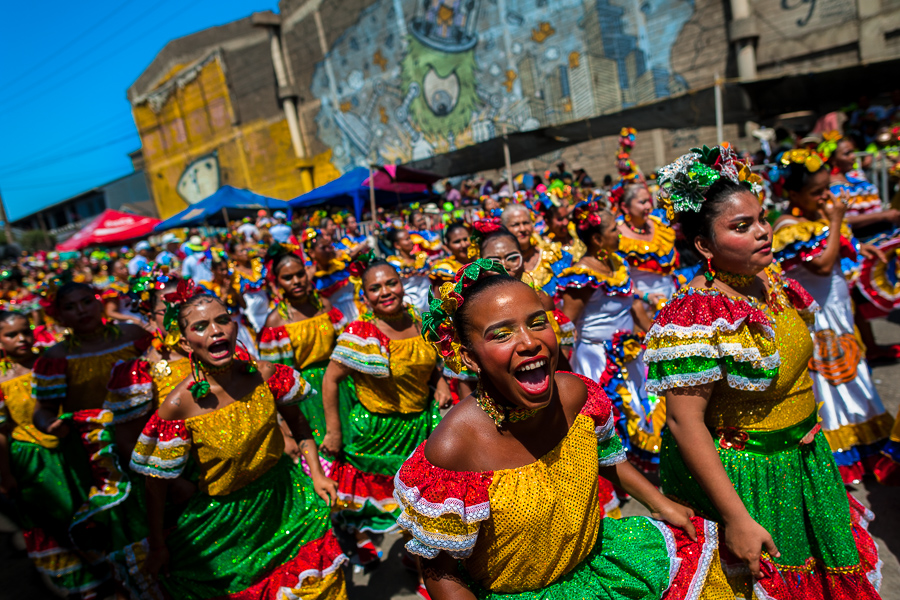 Afro-Colombian women, wearing traditional cumbia outfits, dance the cumbia during the Batalla de Flores, the major parade of the Carnival in Barranquilla, Colombia.