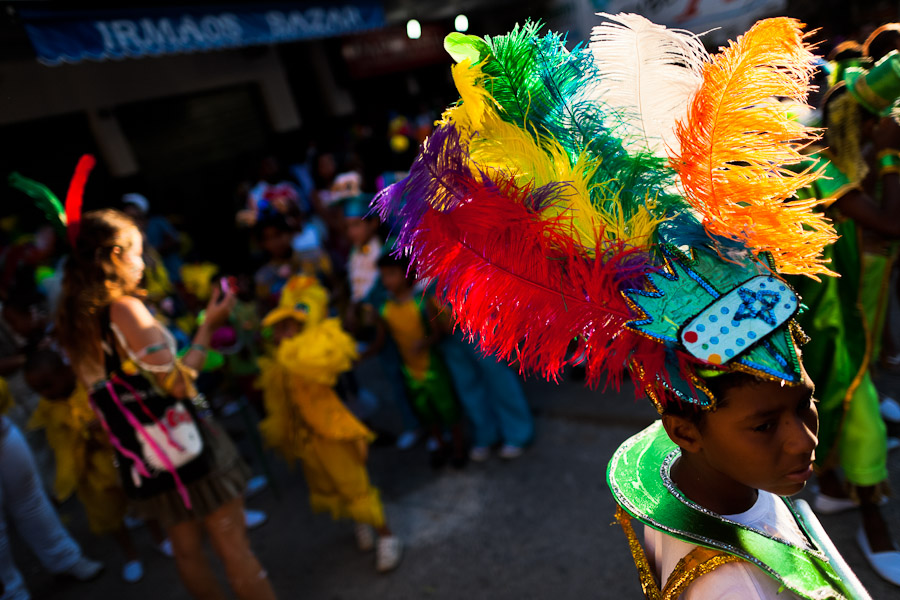 A Brazilian boy, wearing a colorful costume, takes part in the Carnival parade in the favela of Rocinha, Rio de Janeiro, Brazil.